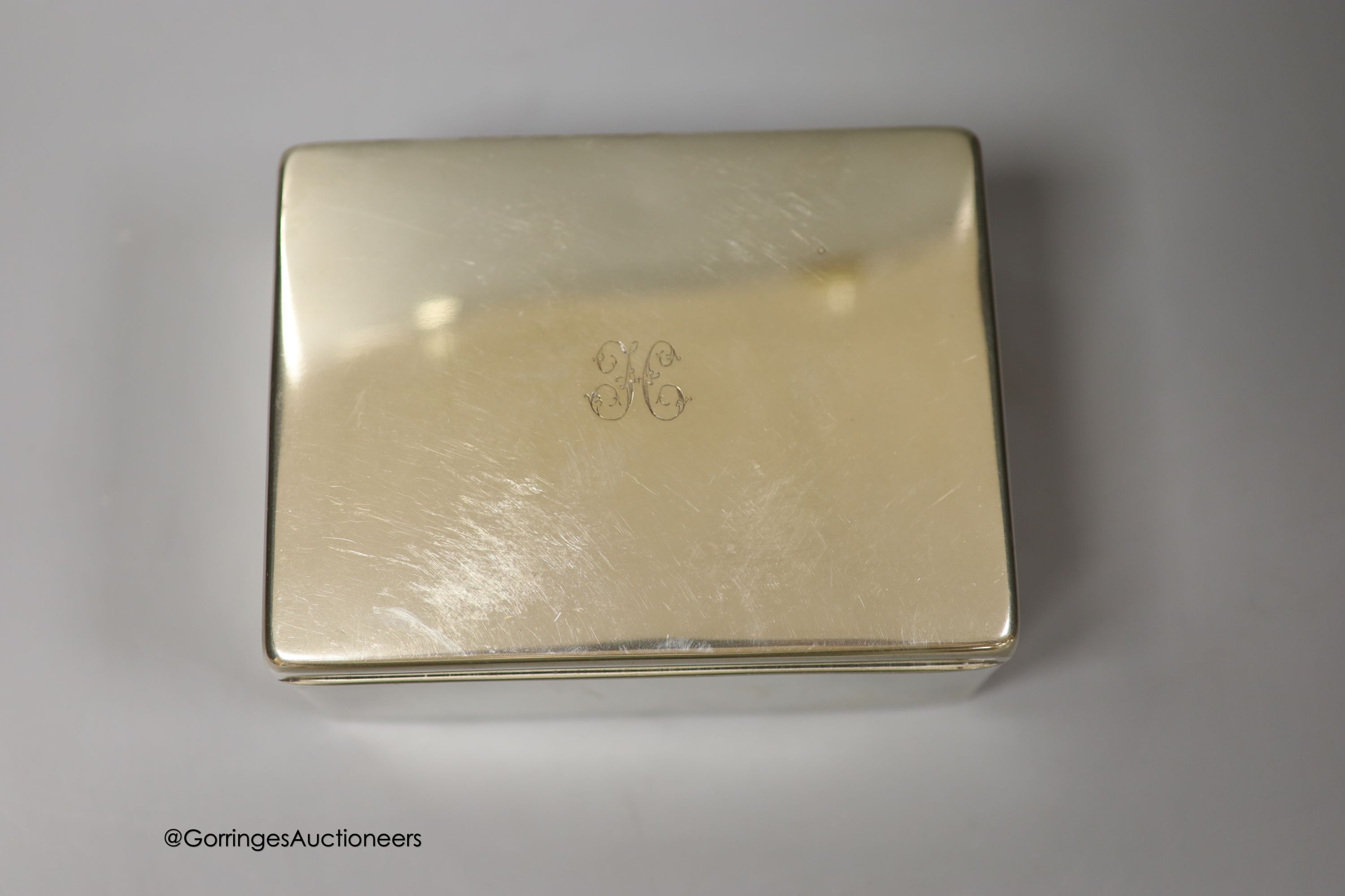 Three 20th century silver mounted cigarette boxes, two with engraved signatures, largest 16.2cm.